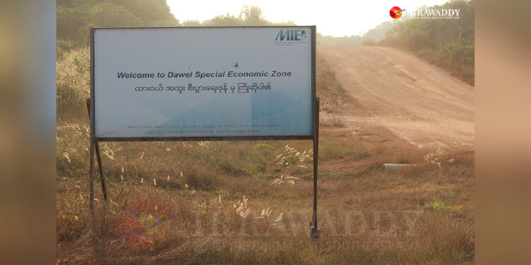 A signpost for the Dawei SEZ is seen in the Nabule area of Dawei district near the Dawei-Ye Highway in the Tanintharyi Region. / Nyein Nyein / The Irrawaddy