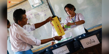 Officials at a polling station in Yangon count ballots cast in the 2015 election. / The Irrawaddy