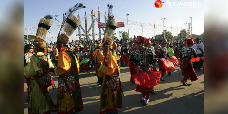 People wearing traditional costumes dance during the annual Manaw Festival in Myitkyina, the capital of northern Myanmar’s Kachin State, in 2011. / The Irrawaddy