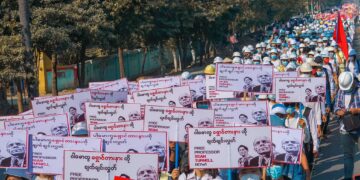 Anti-regime protesters in Mandalay hold placards calling for the release of Professor Sean Turnell on Feb. 22, during the nationwide '22222' general strike. / Ko Ko Phyo