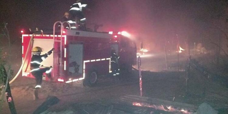 Firefighters extinguishing a fire at a Rohingya IDP camp in Sittwe Township. / Rakhine State Fire Services Department
