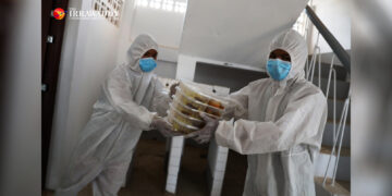 Volunteers deliver food at a COVID-19 quarantine center in Yangon in April. / Myo Min Soe / The Irrawaddy