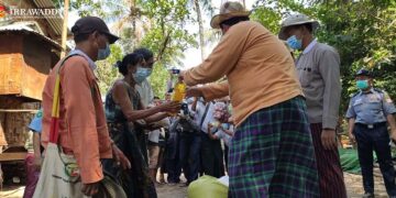 The Ayeyarwady regional government providing basics to the poor in April. / Salai Thant Zin / The Irrawaddy