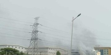 Smoke rises from a fire at a Chinese-owned factory in Hlaing Tharyar, a Yangon industrial zone, on Sunday.