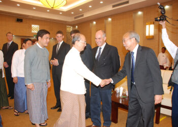 Harn Yawnghwe (R) shakes hands with former President U Thein Sein in 2012 in Naypyitaw / Supplied