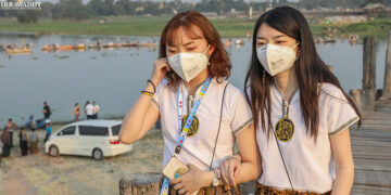 Chinese tourists wear masks as a preventive measure against the coronavirus at the U Pain Bridge in Mandalay on Jan. 30, 2020. / Zaw Zaw / The Irrawaddy