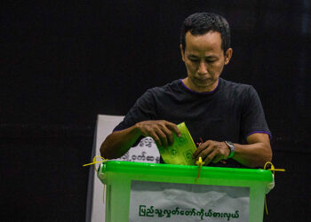 A man casts his vote at a polling station in Yangon during the 2018 by-election. / Htet Wai / The Irrawaddy
