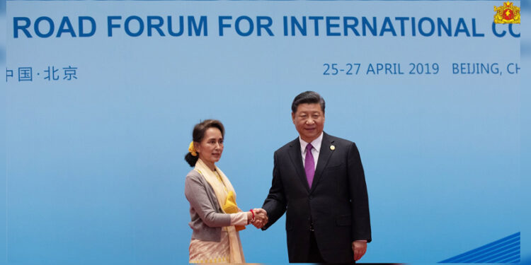 Chinese President Xi Jinping welcomes State Counselor Daw Aung San Suu Kyi to a Belt and Road roundtable discussion at the Yanqi Lake International Conference Center in Beijing on Friday. / State Counselor’s Office / Facebook