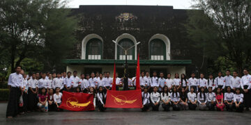 Members of a student union pose for photos in July, 2018 at the front of the Convocation Hall at Yangon University on Adipati Road, the focal venue of the 10-D demonstrations 27 years ago. / Htet Wai / The Irrawaddy