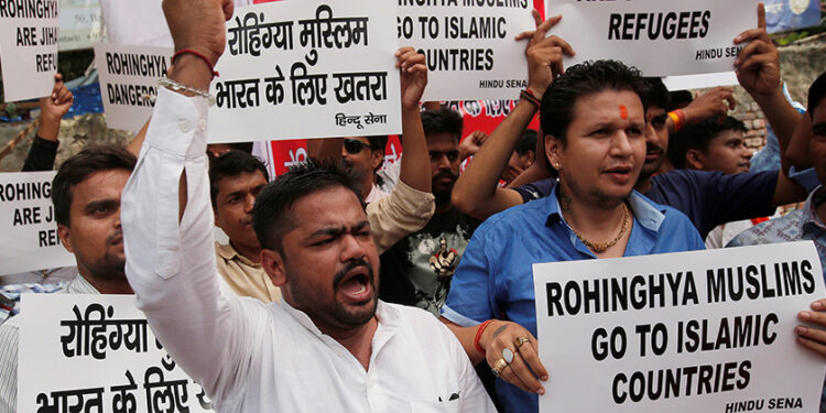 Members of Hindu Sena, a right wing Hindu group, hold placards as they shout slogans during a protest demanding deportation of Rohingya refugees from India, in New Delhi, India, September 11, 2017. / Adnan Abidi / Reuters