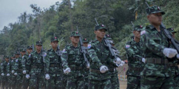 Members of the Karen National Liberation Army, the armed wing of the Karen National Union, march to mark the 69th annual Armed Forces Day in Karen State in February. / Aung Aung Kyaw / Facebook