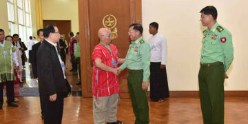 Karen National Union chairman GenSaw Mutu Say Poe shakes hand with Tatmadaw chief Sen Gen Min Aung Hlaing on Monday, Oct. 16 in Naypyitaw.  / Karen National Union HQ Facebook