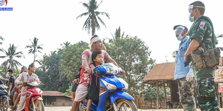 Members of the Karen National Union carry out temperature checks while Karen National Liberation Army soldiers participate in health awareness campaigns in Karen State villages on April 13. / Doo Pla Ya District / Facebook