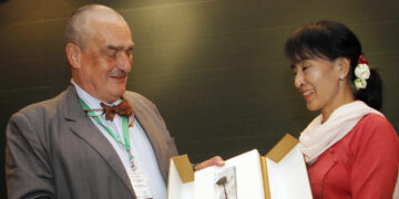 Aung San Suu Kyi receives a posthumous gift from former Czech deputy prime minister Karel Schwarzenberg during a meeting in Naypyidaw, July 17, 2012. / The Irrawaddy
