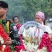 Karen people queue up to lay wreaths at the stone pillar of Karen revolutionary leader Saw Ba U Gyi at a Karen Martyrs Day commemoration at the Karen National Union headquarters on Aug. 12, 2017. / Nyein Nyein / The Irrawaddy