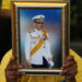 A man wearing a yellow shirt holds up a picture of Thailand's King Maha Vajiralongkorn as he waits for his arrival near the statue of King Rama I in Bangkok, Thailand, May 2, 2019. / Reuters