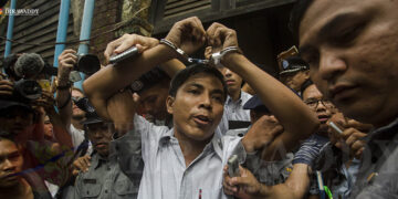 Reuters journalist Kyaw Soe Oo prepares to leave court after being sentenced to seven years in prison in September 2018. / Aung Kyaw Htet / The Irrawaddy