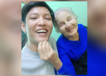 Kyaw Zin Win smiles with his grandmother, Daw Saw Nan, who he lived with his entire life. / Facebook user White Magic