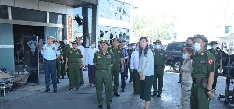 Coup leader Snr-Gen Min Aung Hlaing visits a destroyed Chinese-backed factory in Yangon's Hlaing Tharyar Industrial Zone in April. / Commander-in-Chief’s Office