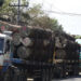 Trucks carrying logs on Thanlyin-Kyauktan Road in Rangoon. / Myo Min Soe / The Irrawaddy
