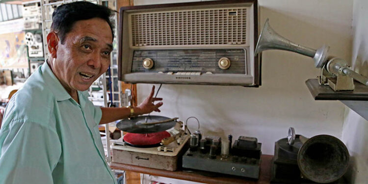 Maung Maung with his record collections in Yangon. (Myo Min Soe/The Irrawaddy.)