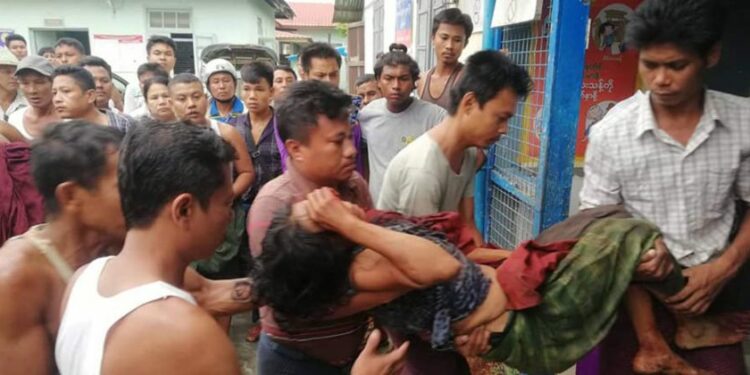 People help a civilian injured in Sabar Htar Village in Minbya Township / Min Aung Khine / The Irrawaddy