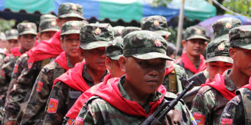 New Mon State National Party troops parade on Mon National Day. / Hintharnee / The Irrawaddy
