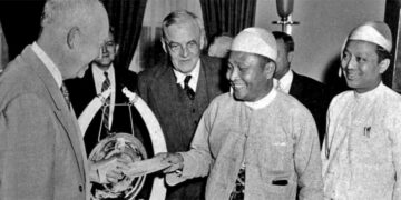 U Nu hands his cheque and gifts to US President Dwight Eisenhower.