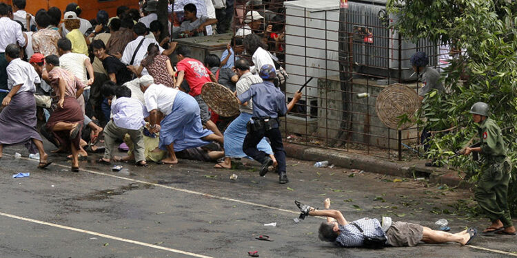 Kenji Nagai of the APF Tokyo lies dying after police and military officials fired on him in Yangon on Sept. 27, 2007. / Reuters