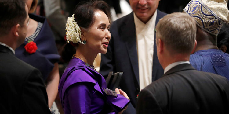 State Counselor Daw Aung San Suu Kyi attends a banquet for newly enthroned Emperor Naruhito hosted by Japanese Prime Minister Shinzo Abe and his wife Akie, at a hotel in Tokyo on Oct. 23, 2019. / Reuters
