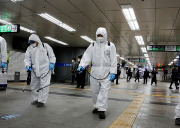 Employees of a disinfection service company sanitize a subway station amid coronavirus fears in Seoul, South Korea on March 11, 2020. / REUTERS