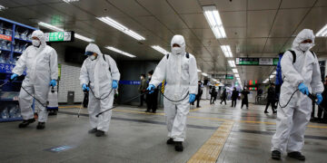 Employees of a disinfection service company sanitize a subway station amid coronavirus fears in Seoul, South Korea on March 11, 2020. / REUTERS
