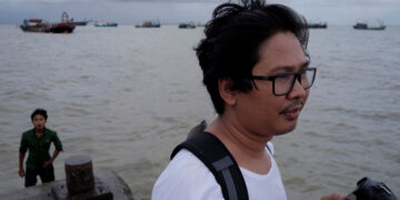 Reuters journalist Wa Lone, who is based in Myanmar, is seen working in Sittwe in the state of Rakhine, Myanmar September 18, 2017. / Reuters