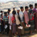 Rohingya refugees stand in a queue to collect aid supplies in Kutupalong refugee camp in Cox's Bazar, Bangladesh, Jan. 21. / Reuters