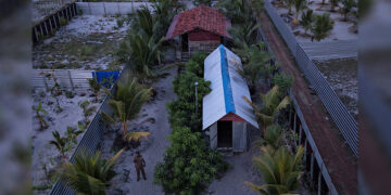 A police officer stands inside a training camp allegedly linked to Islamist militants in Kattankudy, near Batticaloa, Sri Lanka on May 5, 2019. / Reuters