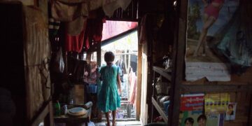 This 12-year-old girl in Seikgyikanaungto Township dropped out of school due to her family’s financial problems, her mother said. / Soe Win Nyein