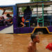 Children play in an area flooded after heavy rains in Jakarta, Indonesia on Jan. 2, 2020. / REUTERS