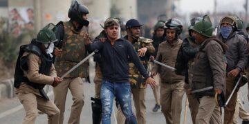 Police officers detain a demonstrator during a protest against a new citizenship law in the Seelampur neighborhood of New Delhi, India on Dec. 17, 2019. / Reuters