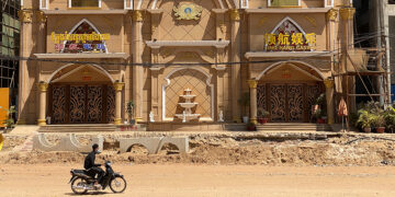 A motorbike drives past a closed casino in Sihanoukville, Cambodia on Feb. 16, 2020. / REUTERS