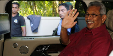 President-elect Gotabaya Rajapaksa waves at his supporters as he leaves his house in Colombo on Nov. 17, 2019. / Reuters