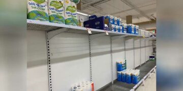 Empty shelves are pictured at a Coles supermarket following reports of coronavirus in the Canberra suburb of Manuka, Australia, on March 2, 2020. / REUTERS