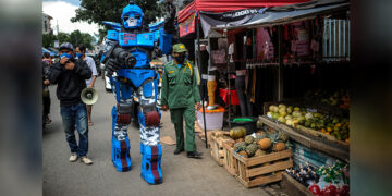 A man wearing a ‘Transformers’ costume appeals to citizens to stay at a home amid the COVID-19 outbreak in Bandung, Indonesia on May 4, 2020. ANTARA / REUTERS
