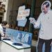 A man washes hands at a hand-washing station to prevent the spread of COVID-19, in front of a picture of President Joko Widodo in Yogyakarta, Indonesia on March 30, 2020. / ANTARA / REUTERS