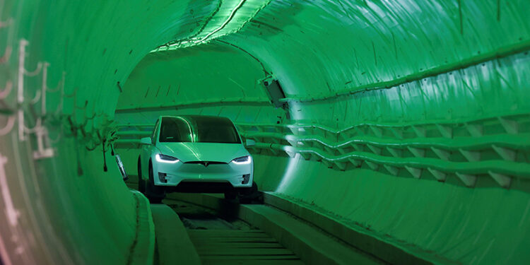 A modified Tesla Model X drives into the tunnel entrance before an unveiling event for the Hawthorne test tunnel created by Elon Musk’s Boring Co. in Hawthorne, California, on Dec. 18, 2018. / REUTERS