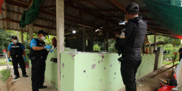 Thai forensic experts and military personnel examine the site where at least 15 people were killed by suspected separatist insurgents in Yala province, southern Thailand, on Nov. 6, 2019. / Reuters
