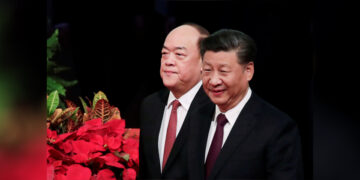 Chinese President Xi Jinping and new Macau Chief Executive Ho Iat-seng arrive for a ceremony to inaugurate the fifth-term government of the Macau Special Administrative Region and to celebrate the 20th anniversary of the former Portuguese colony's return to China, in Macau on Dec. 20, 2019. / REUTERS