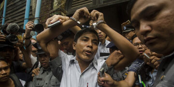 Reuters journalist Kyaw Soe Oo prepares to leave the court after being sentenced to seven years in prison in September 2018. / Aung Kyaw Htet