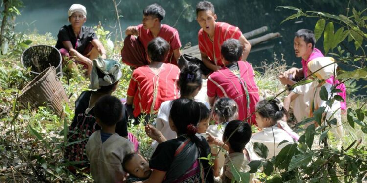 Indigenous Karen People relax on a riverbank in the proposed Salween Peace Park. / KESAN