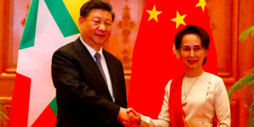 Chinese President Xi Jinping and Myanmar State Counselor Daw Aung San Suu Kyi shake hands on Jan. 18. / Nyein Chan Naing / EPA / POOL