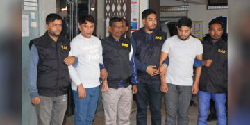Two Cox’s Bazar men arrested on suspicion of trafficking Rohingya women are seen with Bangladeshi police at a house in Dhaka on Sunday. / Supplied